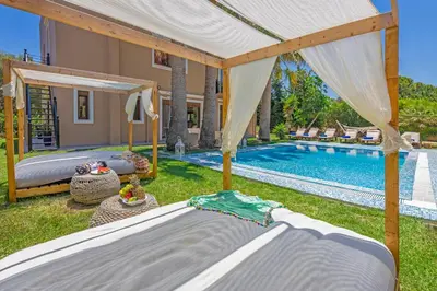 a bedroom with a bed and a swimming pool at Luxury Mansion Rhodes in Ialyssos