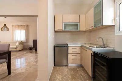 a kitchen with a sink and a dishwasher at IL PARADISO DI MICHAIL in Phanaes
