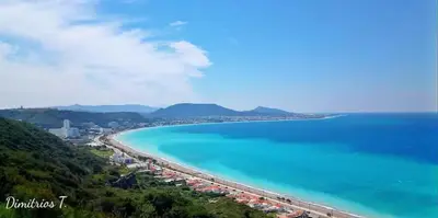 a view of a beach with turquoise water at Nitsas studio's in Kremasti
