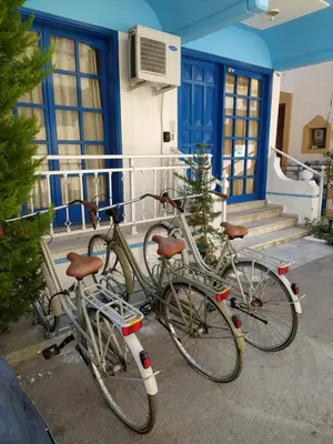 a group of bikes parked outside of a house at Nitsas studio's in Kremasti