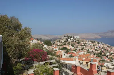 a view of a town on a hill at Astradeni in Symi