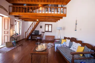 a living room with a couch and a table at Avra in Symi
