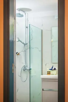 a bathroom with a shower with a glass door at Bella Foresta Villa II in Rhodes Town
