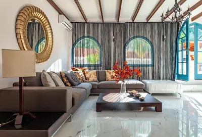 a living room with a couch and a table at Bella Foresta Villa II in Rhodes Town