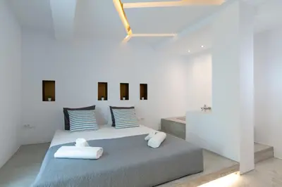 a bedroom with a bed with two pillows at ELiteDIMension in Rhodes Town