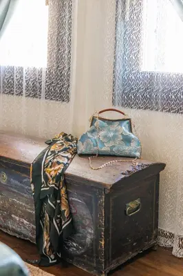 an old trunk with a bag sitting on top of it at OLD TOWN CLASSIC HOUSE RHODES in Rhodes Town