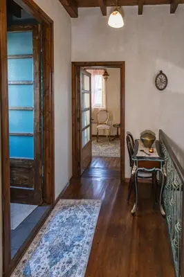 a hallway with a door and a table and a chair at OLD TOWN CLASSIC HOUSE RHODES in Rhodes Town