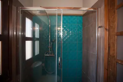 a bathroom with a shower with a glass door at OLD TOWN CLASSIC HOUSE RHODES in Rhodes Town