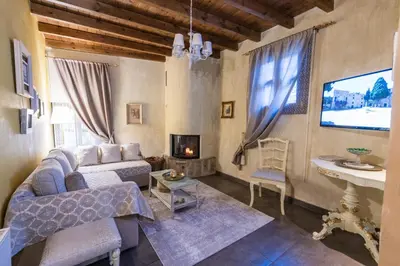 a living room with a couch and a tv at OLD TOWN CLASSIC HOUSE RHODES in Rhodes Town