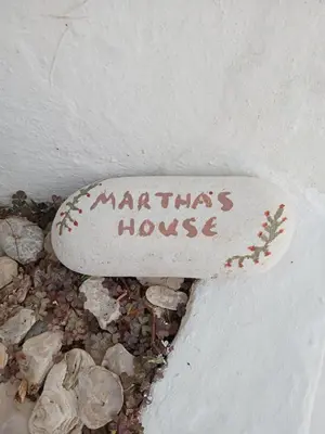 a rock with the words maritzitz house written on it at Marthas Traditional House in Symi