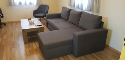 a living room with a couch and a table at MA-GIA in Pastida