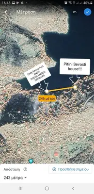 a screenshot of a map with two signs on it at Pitini Sevasti house in Symi