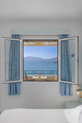 a room with a window with a view of the ocean at Haraki Memories Beach Studios in Haraki