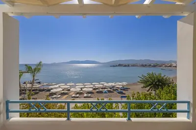 a view of the beach from the balcony of a villa at Haraki Memories Beach Studios in Haraki