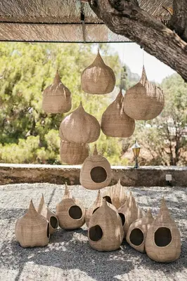 a group of wooden birdhouses sitting on the ground at Casita Casita Lindos - Adults Only in Líndos