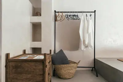 a room with a wooden desk and a basket at Casita Casita Lindos - Adults Only in Líndos