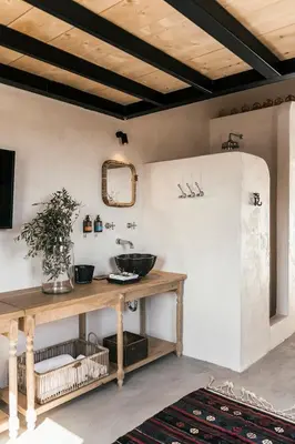 a bathroom with a counter with a sink and a mirror at Casita Casita Lindos - Adults Only in Líndos