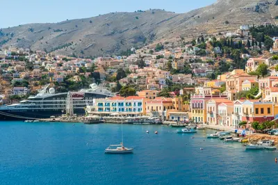 a view of a town with boats in the water at Villa Ioanna in Symi