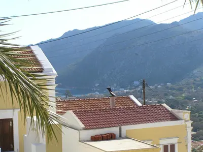 a house with a view of a mountain at EVANNA HOUSE in Symi