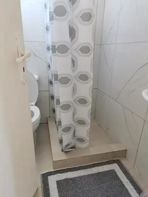 a bathroom with a toilet and a shower stall at Loft for 2 in Rhodes town near Elli beach in Rhodes Town