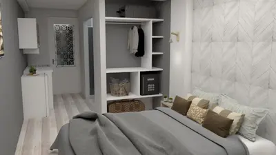 a bedroom with a bed with a grey blanket at RHODIAN TREASJURE Spiridione Studios in Faliraki