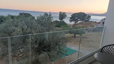 a balcony with a view of the ocean at Tesoro Del Mare in Pefki Rhodes