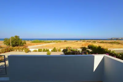 a view of the ocean from the balcony of a house at S-EVA RESORT in Kolimbia