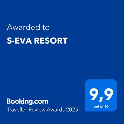 a blue sign with the text awarded to s eva resort at S-EVA RESORT in Kolimbia