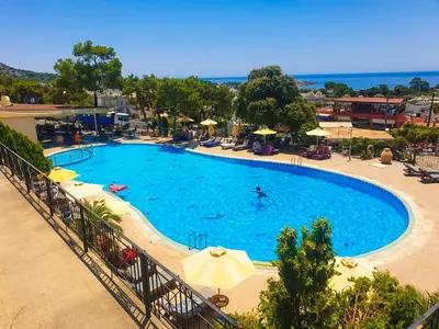 a large swimming pool with a person swimming in it at Blue Vision Luxury House in Pefki Rhodes