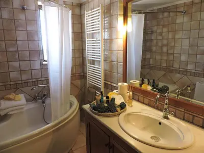 a bathroom with a tub and a sink and a bath tub at Blue Vision Luxury House in Pefki Rhodes