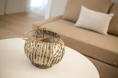 a wicker basket sitting on top of a table at Avi Suites Faliraki in Faliraki