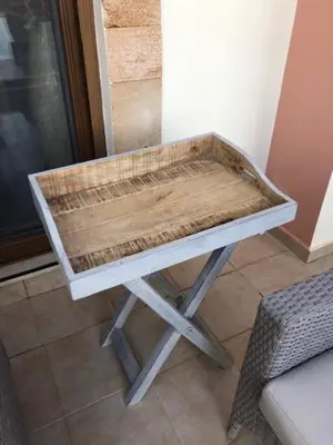 a wooden table sitting on top of a floor at Luxury Villa Delfini in Líndos