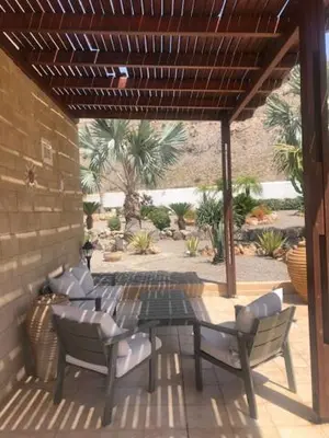 a patio with a table and chairs on a patio at Luxury Villa Ioannis in Líndos