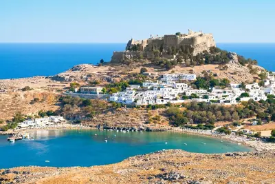 a view of a small island with a castle on a hill at Casa Pietra Lindos Luxury Traditional House in Líndos