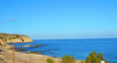 a view of the ocean from a beach at George's Studios in Archangelos