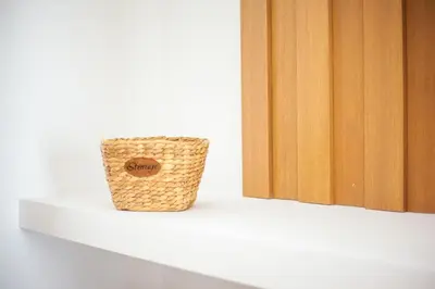 a basket sitting on a shelf next to a door at Alexander Studios & Suites - Adults Only in Faliraki