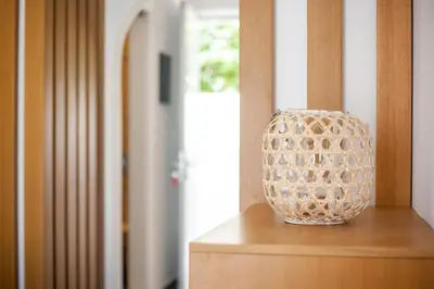a vase sitting on top of a wooden table at Alexander Studios & Suites - Adults Only in Faliraki