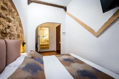 a bedroom with a bed in a room at Casa De La Sera in Rhodes Town