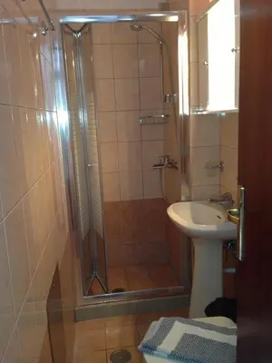 a bathroom with a shower and a sink at Stavros Pension in Rhodes Town
