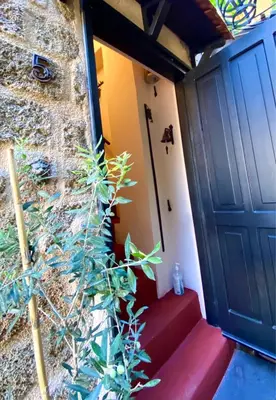 a door to a house with a plant next to it at Grand Master Suite in Rhodes Town