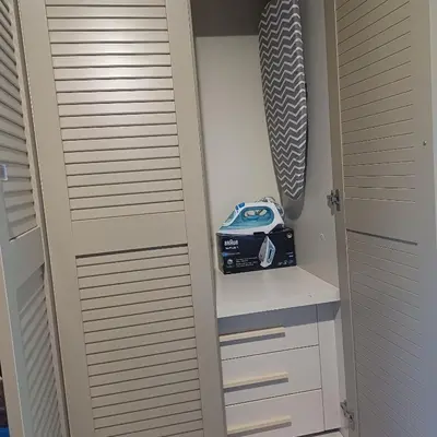 a closet with a door and a radio on it at Holiday Nest & parking in Ialyssos