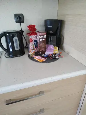 a counter top with a coffee pot and a tray of food at Holiday Nest & parking in Ialyssos