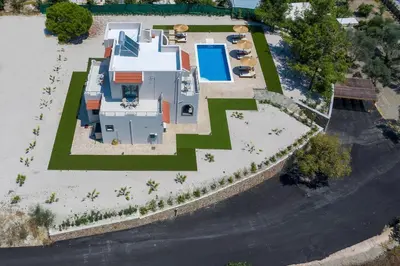 an aerial view of a house with a yard at Sun's Reach Villa in Rhodes Town