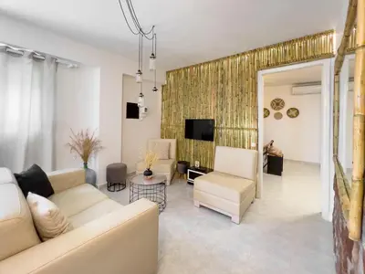 a living room with a couch and a tv at LA Casa Di Lusso N4 - Adults Only in Kolimbia