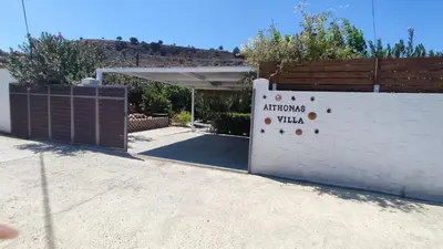 a garage with a sign on the side of it at Aithonas Villa in Archangelos