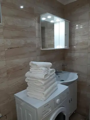 a bathroom with a washing machine and a sink at Faliraki Holidays in Faliraki