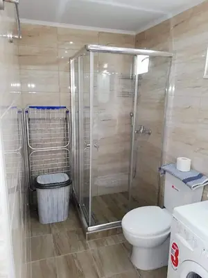 a bathroom with a shower and a toilet at Faliraki Holidays in Faliraki
