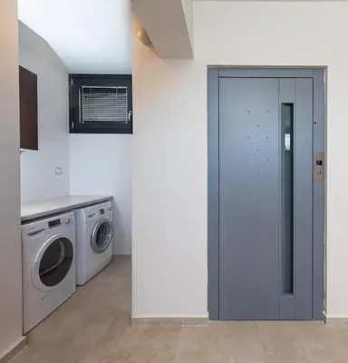 a laundry room with a washer and dryer at Ixia Breeze 1 in Ixia