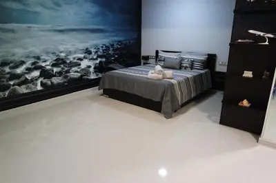 a bedroom with a bed with a picture of animals at Ixia Breeze 1 in Ixia