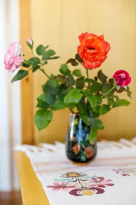 a vase filled with flowers sitting on a table at House Salvia in Lachania